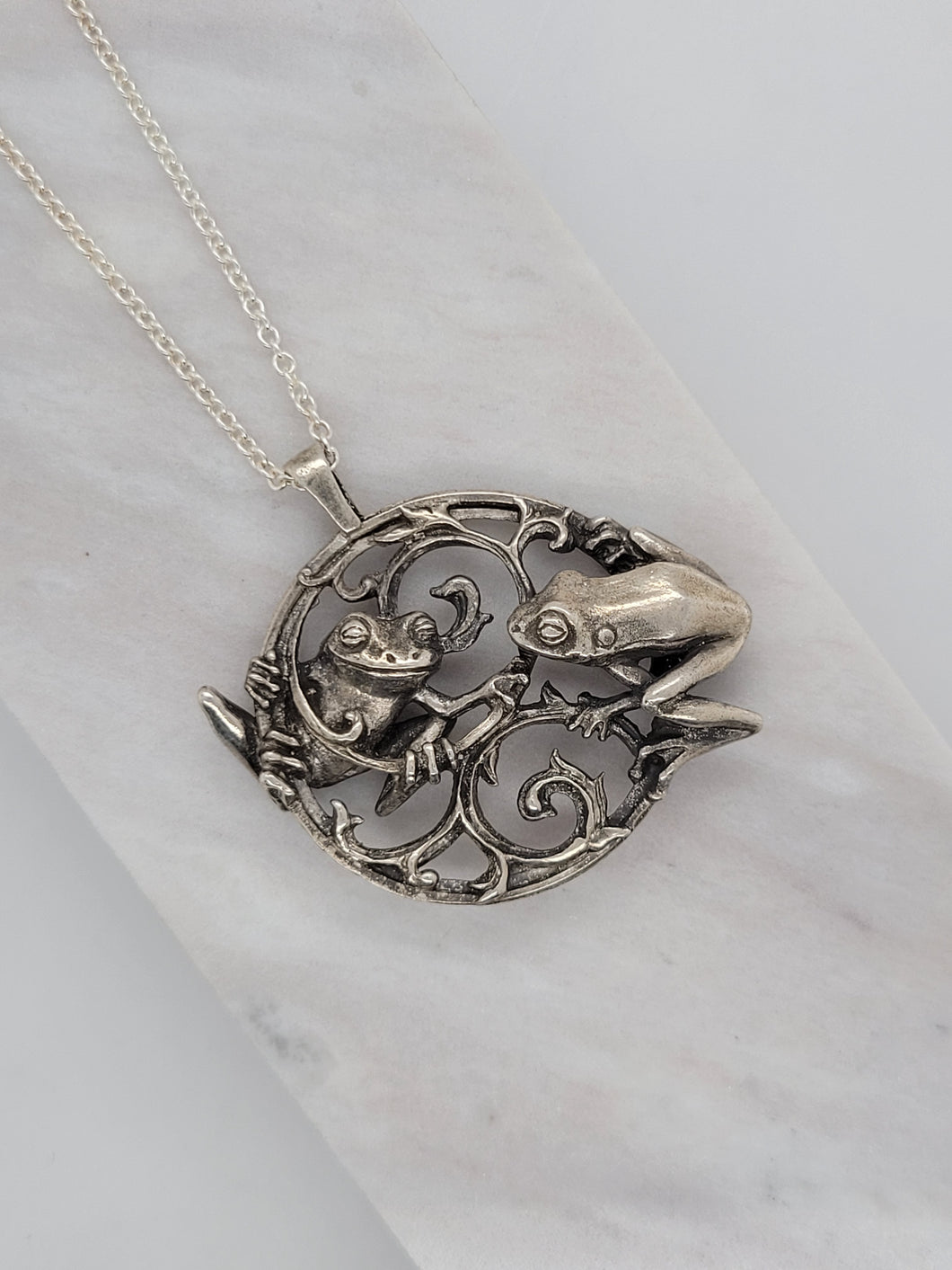 CHARMED FROGS NECKLACE