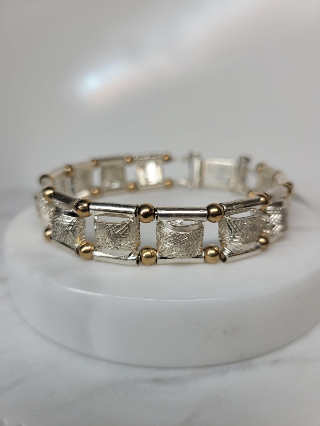 Textured sterling silver bracelet with 14K gold bead accents
