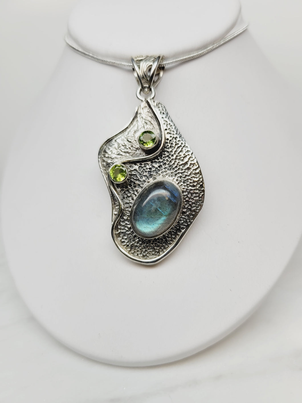 Textured sterling silver pendant with labradorite and peridot accents