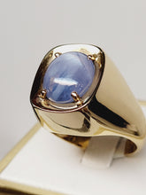 Load image into Gallery viewer, Blue Star Sapphire set in a 14k Yellow Gold band