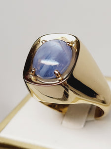 Blue Star Sapphire set in a 14k Yellow Gold band
