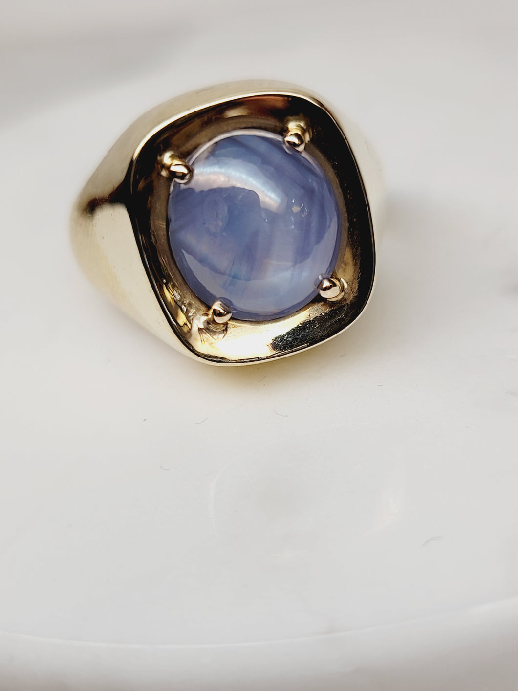 Blue Star Sapphire set in a 14k Yellow Gold band