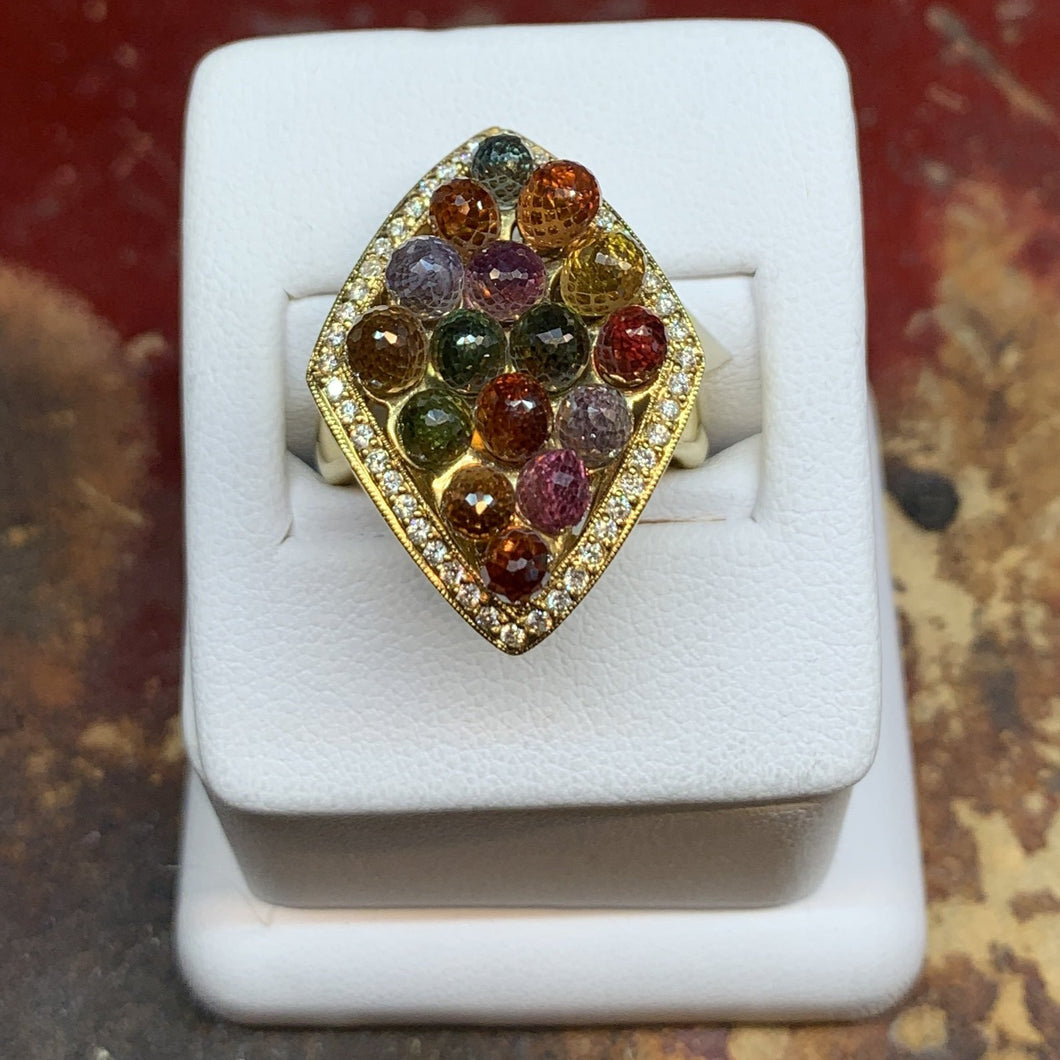 Multi Gemstone (many are Garnets) individually set briolettes and Diamonds sent in 18k Yellow Gold band