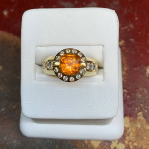 Natural Orange Sapphire and Diamonds set in an 18k Yellow Gold Halo